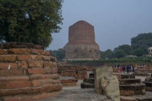 Sarnath, Varanasi, India, December 5, 2017: Tourists and pilgrims visiting the holy Buddhist site, Sarnath.